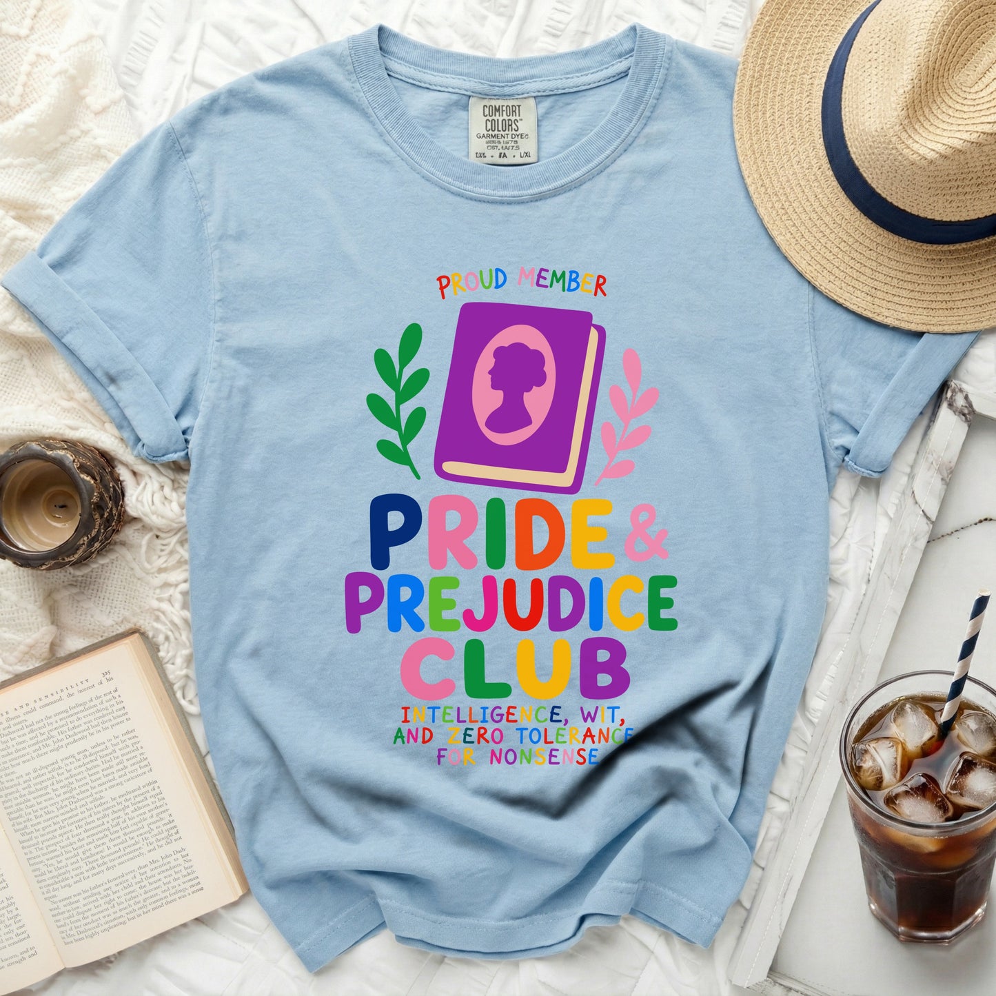 Light blue Comfort Colors t-shirt with Pride & Prejudice Club graphic and distressed book details.