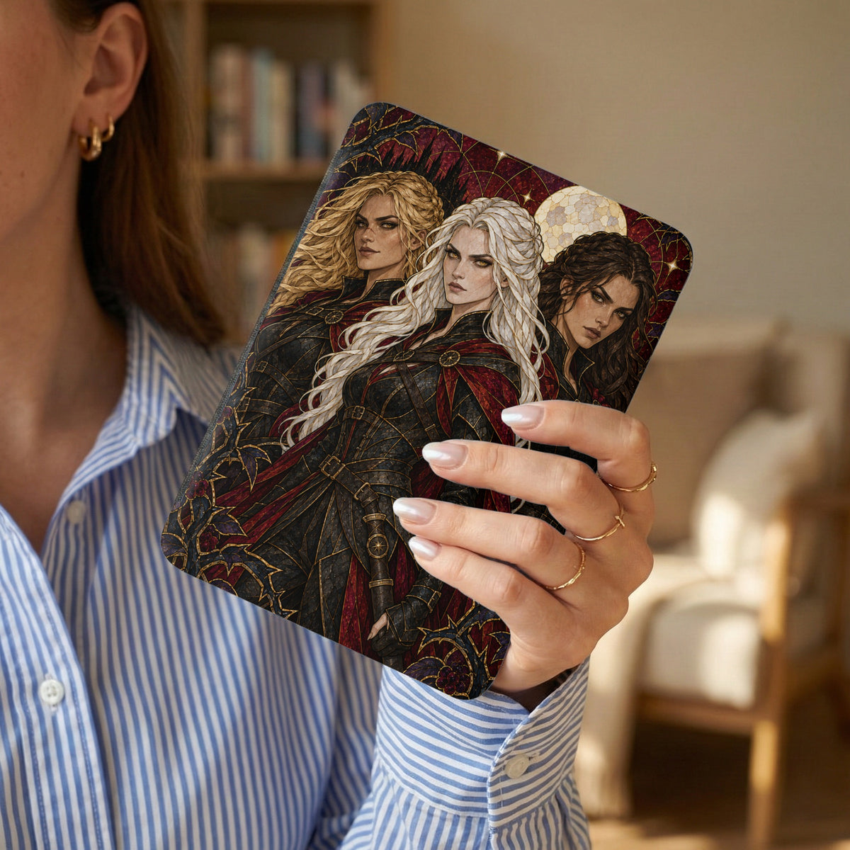 Book cover art featuring three women in dark armor under a moonlit sky.