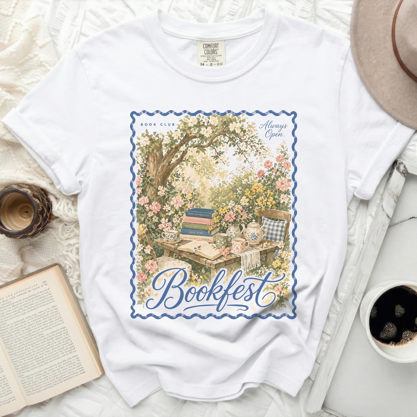 White t-shirt with a vintage book garden design and "Bookfest" text.