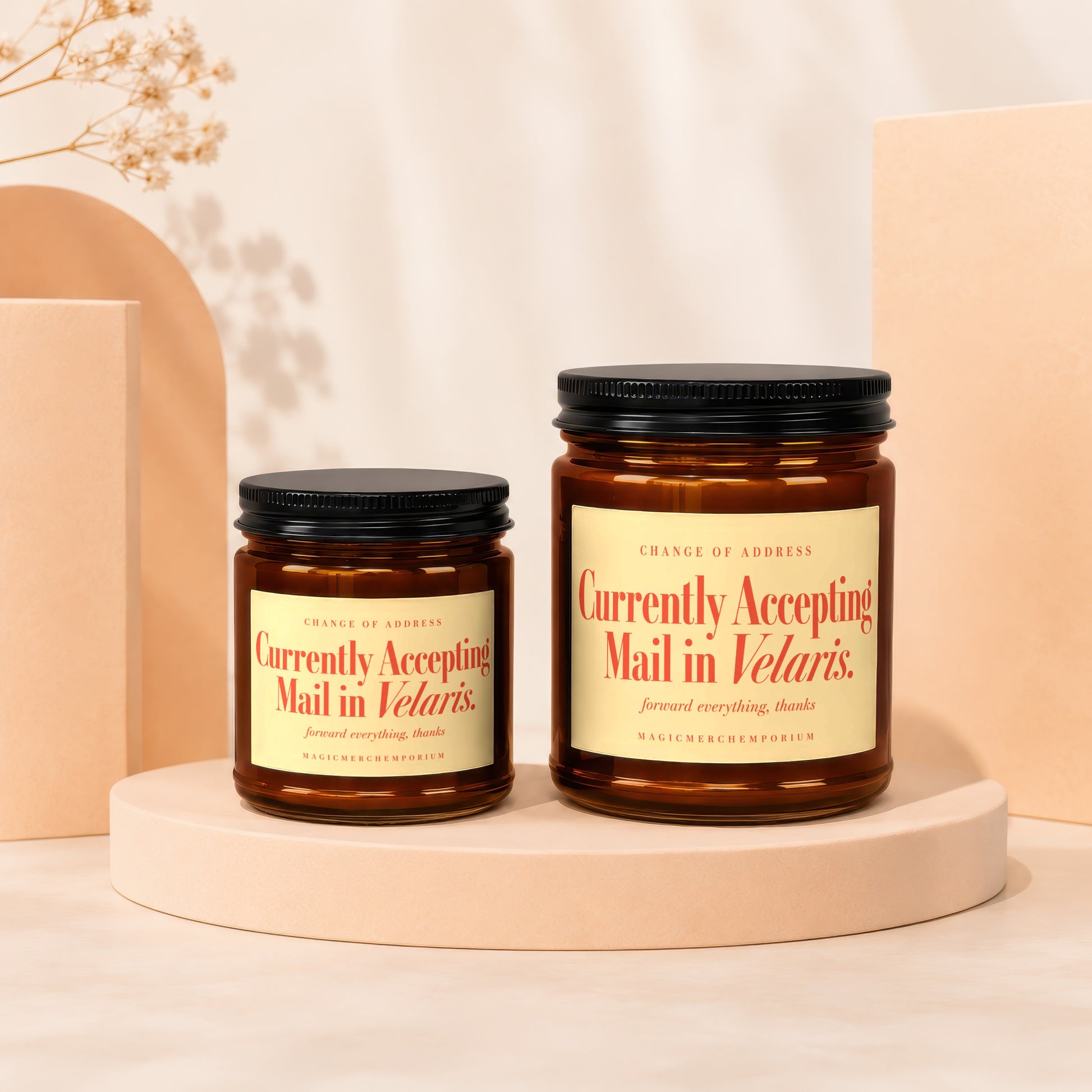Two amber apothecary jars with black lids, labeled "Currently Accepting Mail in Velaris."