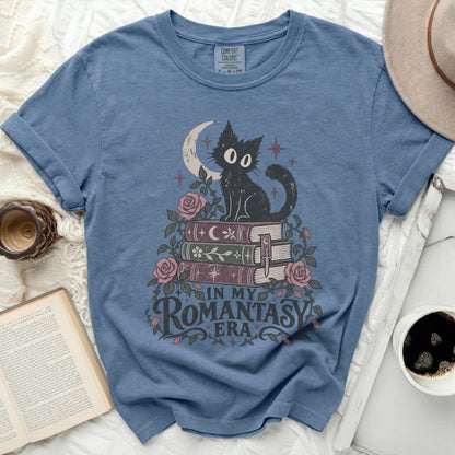 Black cat on books with moon, stars, roses, and "In My Romantasy Era" text.