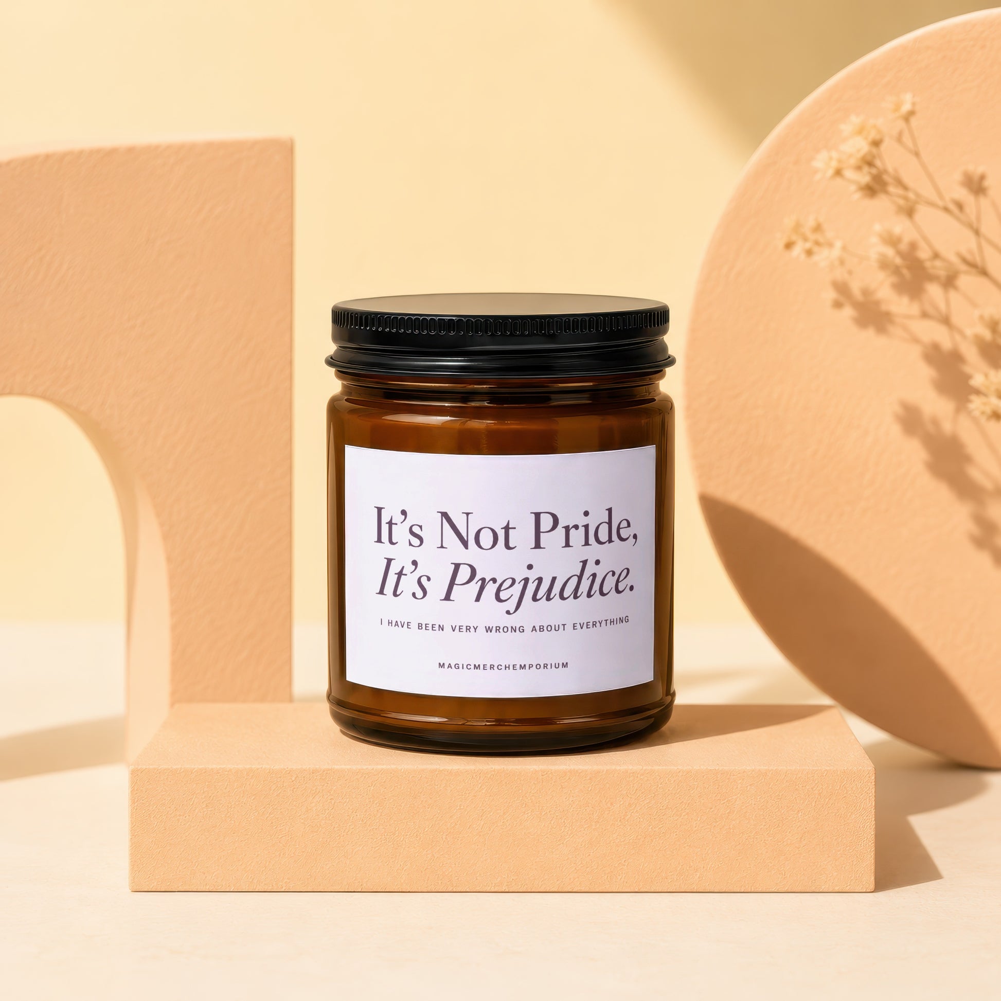 Amber glass candle with white label reading "It's Not Pride, It's Prejudice."