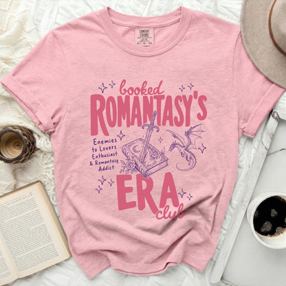 Pink t-shirt with "Booked Romantasy's ERA Club" text and graphics.