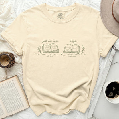Cream t-shirt with "just one more page BOOK CLUB" and open book design.