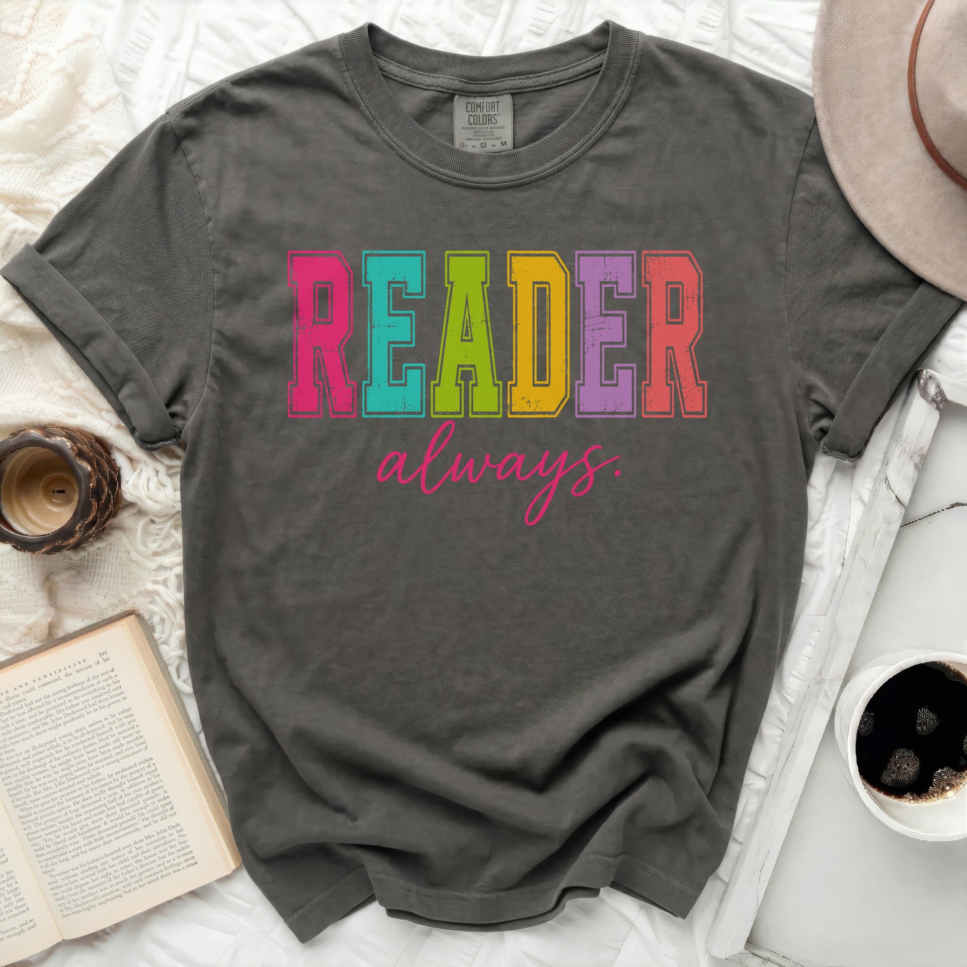 Comfort Colors dark grey t-shirt with "READER always" in colorful block letters.