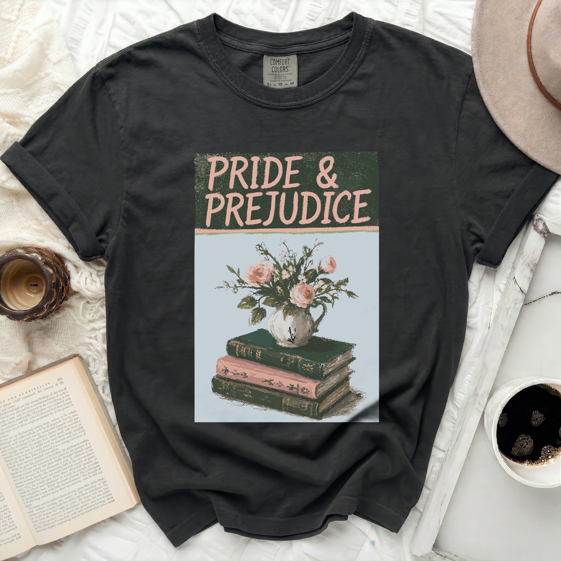 Grey t-shirt with "Pride & Prejudice" text and floral book illustration.