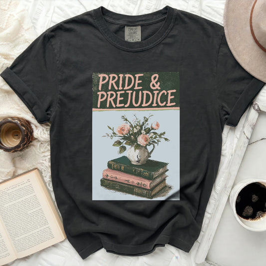 Grey t-shirt with "Pride & Prejudice" text and floral book illustration.