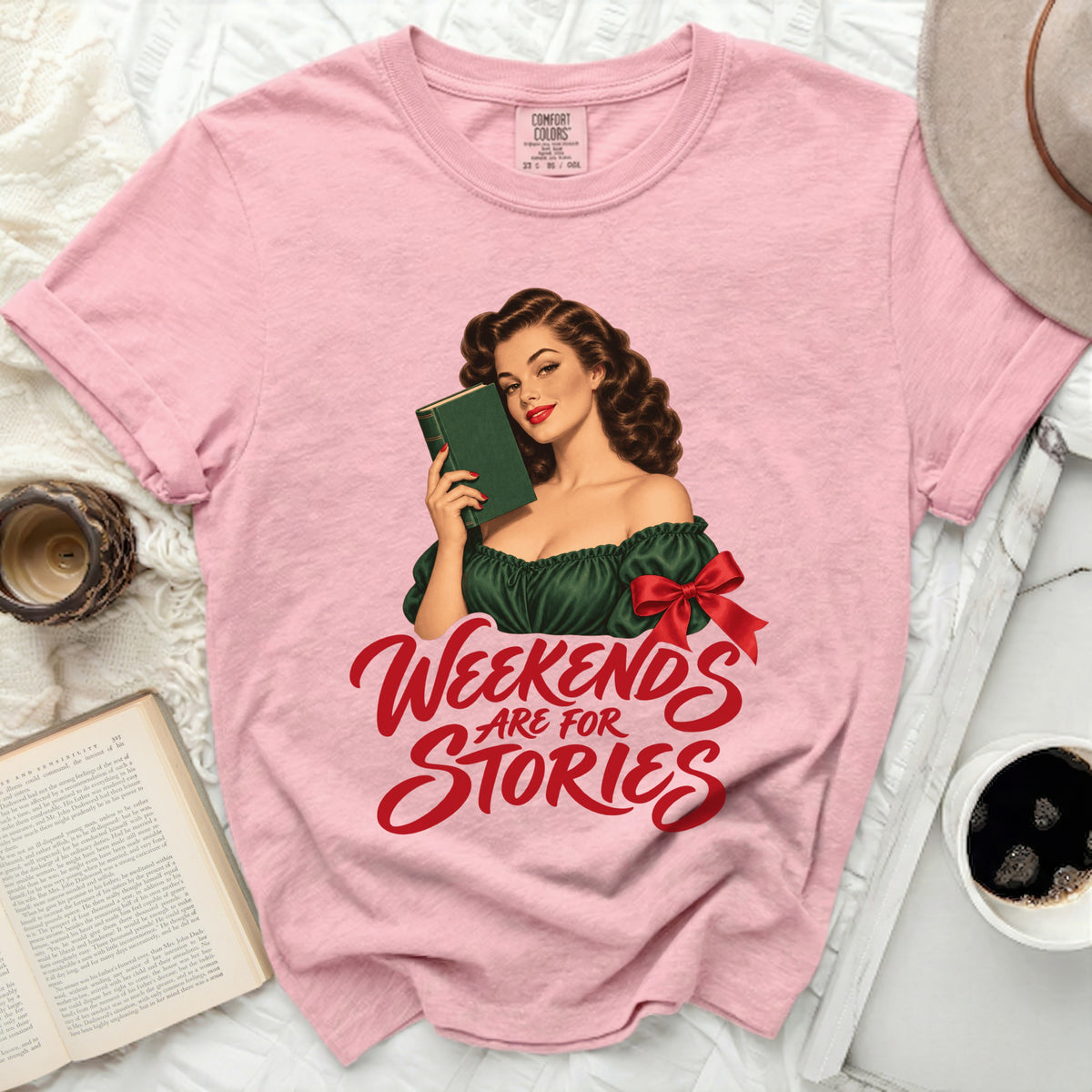 Pink t-shirt with "Weekends Are For Stories" graphic and vintage woman reading.