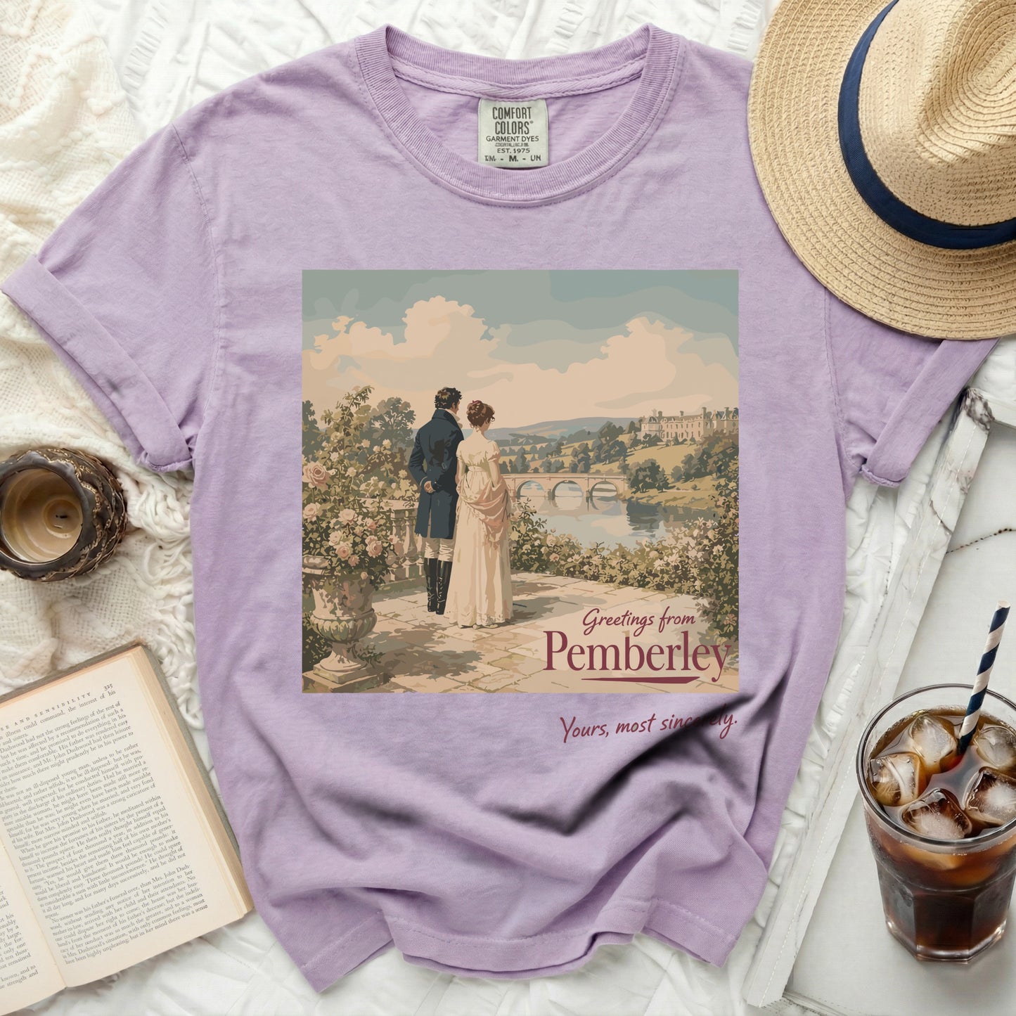 Purple t-shirt with painting of couple at Pemberley and text "Greetings from Pemberley Yours, most sincerely."