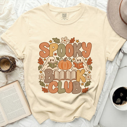 Cream t-shirt with "Spooky Book Club" text and fall-themed graphics.