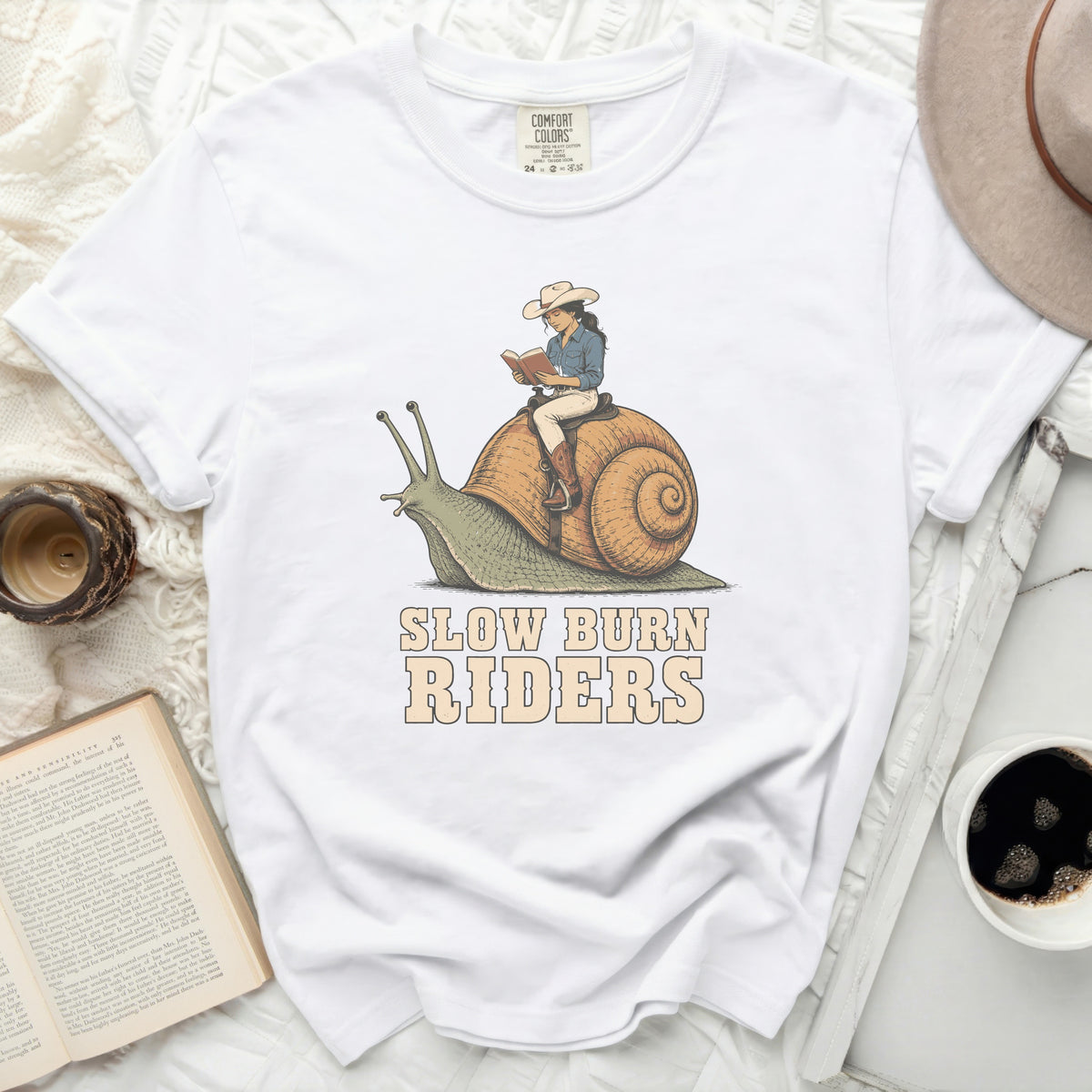 White t-shirt with "Slow Burn Riders" and a woman riding a snail.
