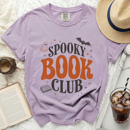 Purple t-shirt with "Spooky Book Club" graphic, ghost, bat, and book.