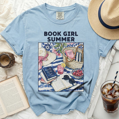 Light blue t-shirt with "Book Girl Summer" graphic, straw hat, books, and lemonade.
