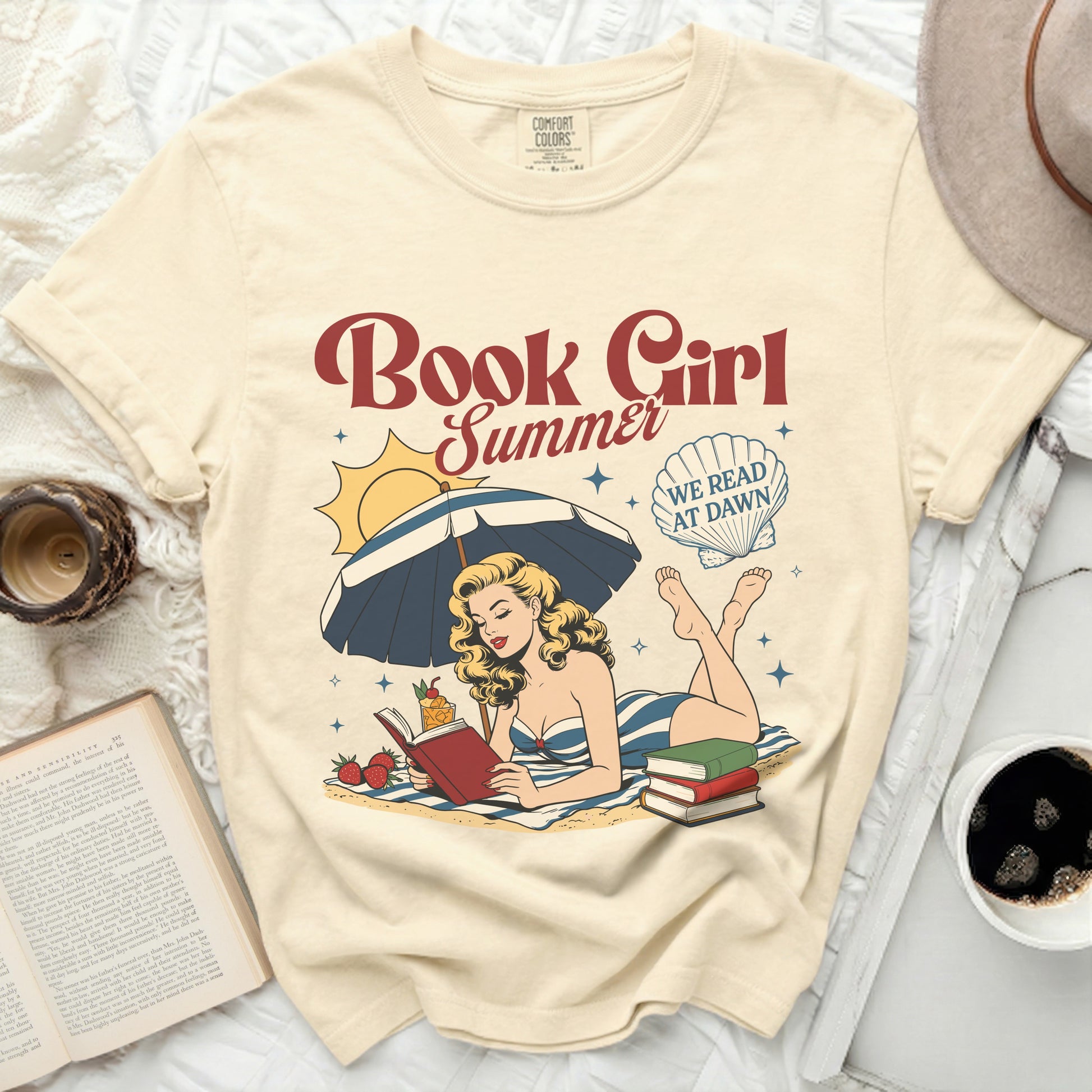 Cream t-shirt with "Book Girl Summer" and beach reading graphic.