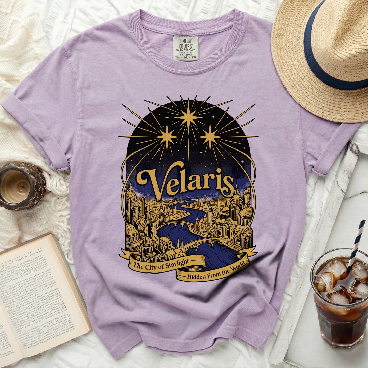 Lavender t-shirt with "Velaris The City of Starlight" graphic.