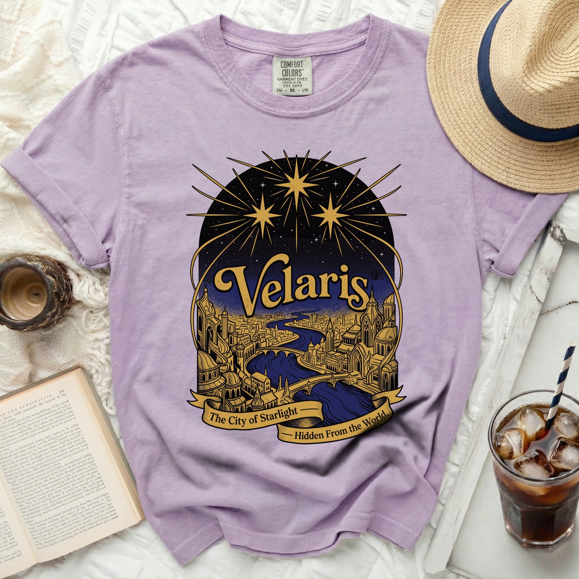 Lavender t-shirt with "Velaris The City of Starlight" graphic.