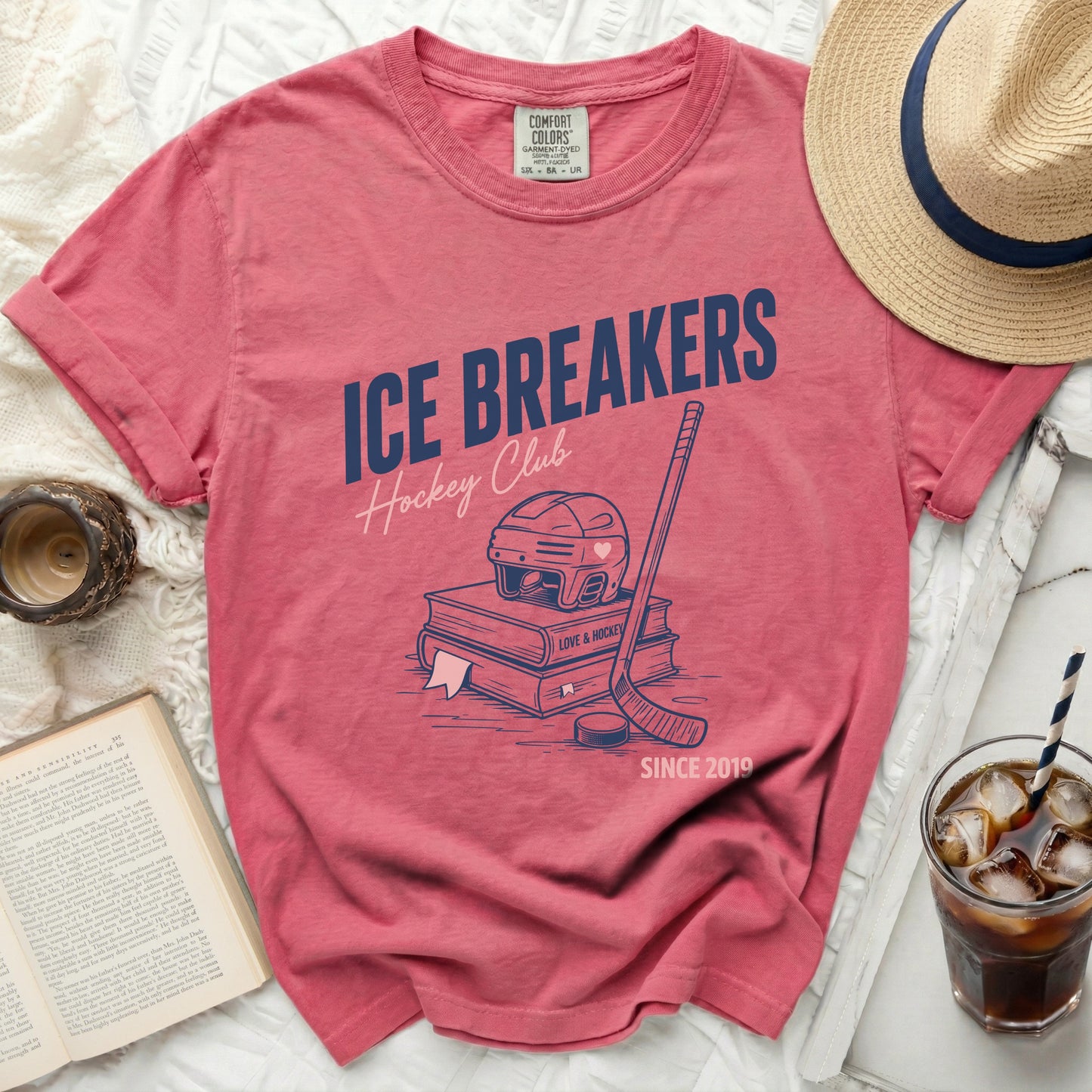 T-shirt with "Ice Breakers Hockey Club" and hockey stick graphic.