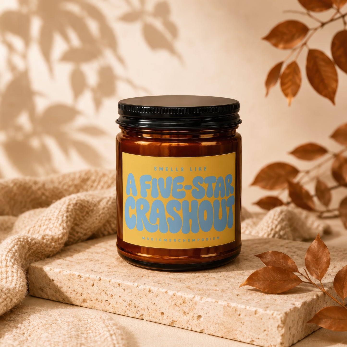 Amber candle with a yellow label that reads "Smells Like A Five-Star Crashout".