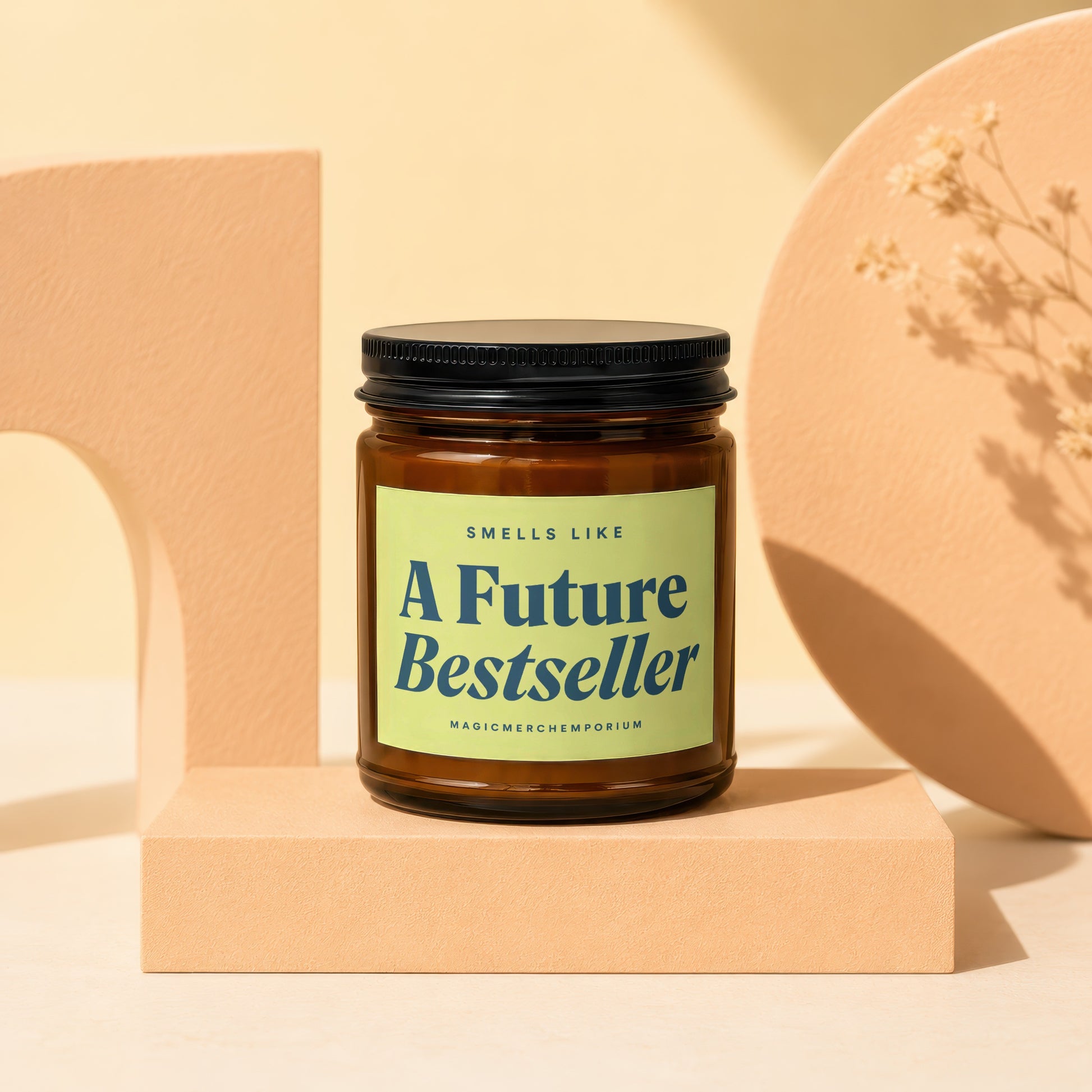Glass jar candle with a bright green label reading "Smells Like A Future Bestseller".