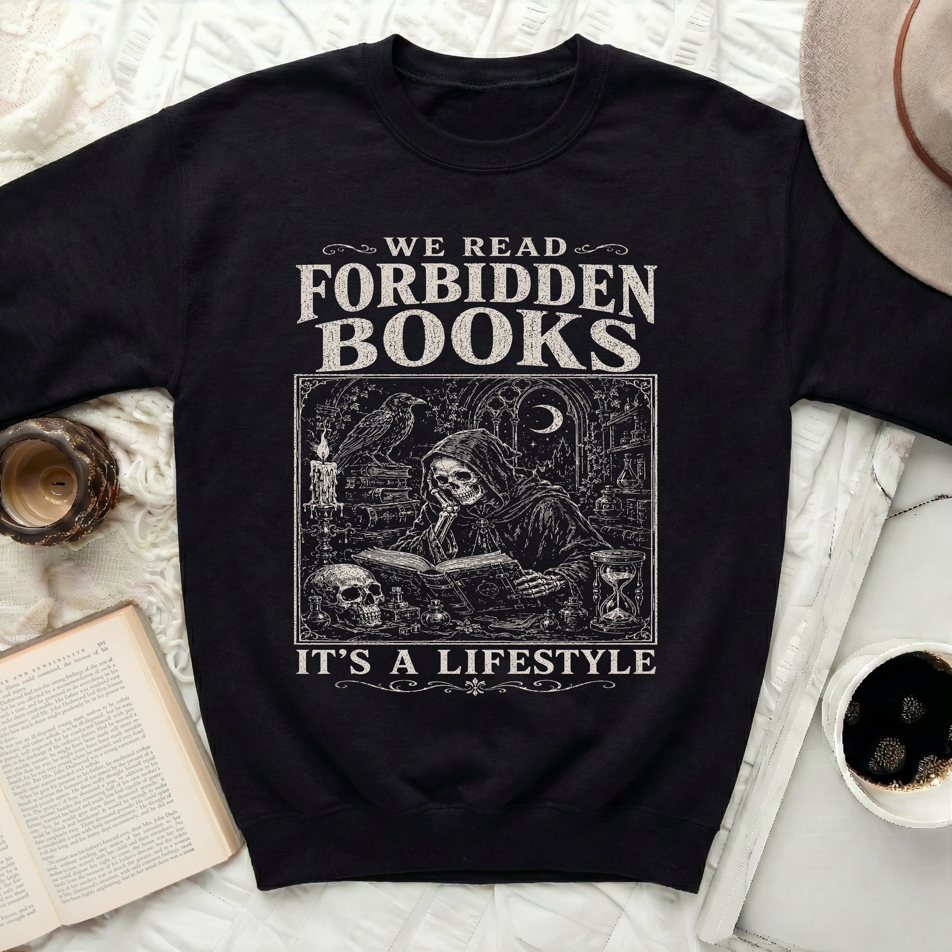 Black sweatshirt with "We Read Forbidden Books It's A Lifestyle" graphic.