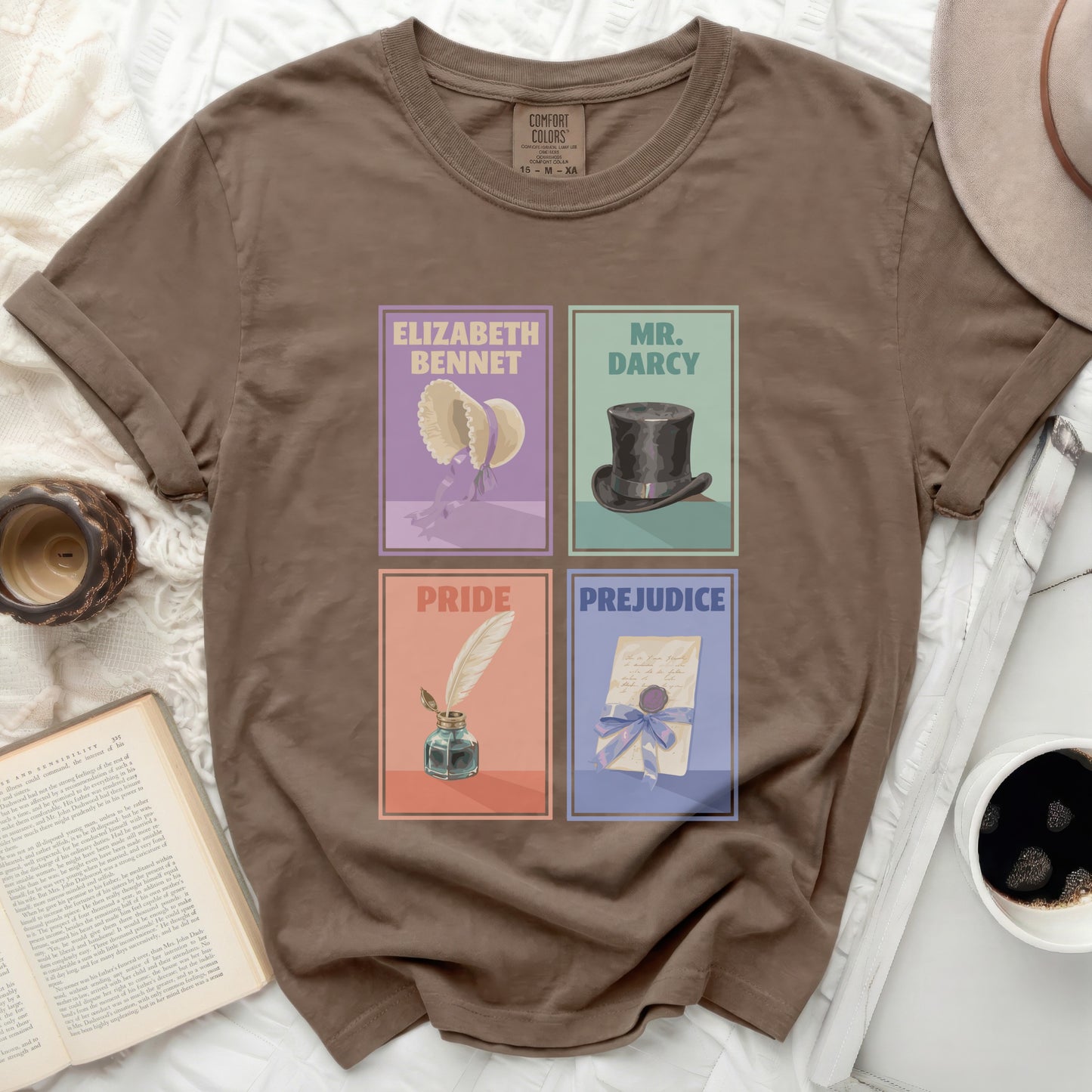 Brown t-shirt with four illustrations: Elizabeth Bennet, Mr. Darcy, Pride, Prejudice.