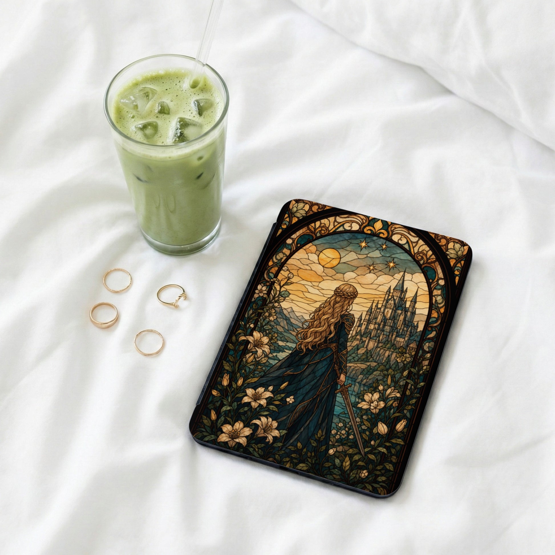 Tablet case with stained glass design of a woman, a castle, and floral elements.