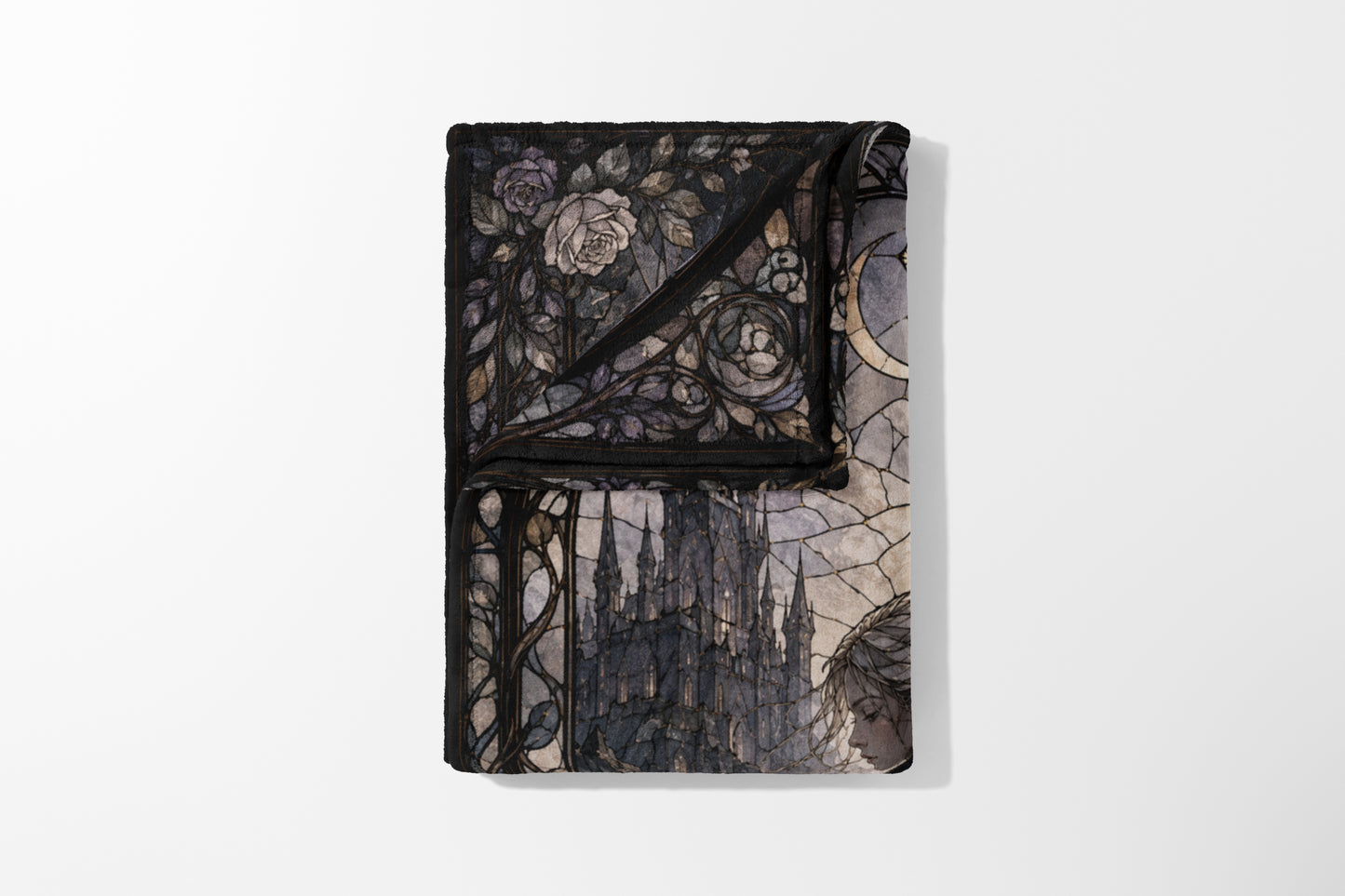 Folded blanket with stained glass design of roses, castle, and a woman.