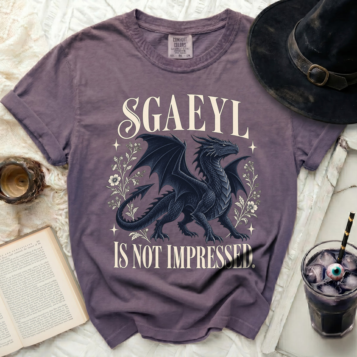 Purple t-shirt with a black dragon and text "SGAEYL IS NOT IMPRESSED."
