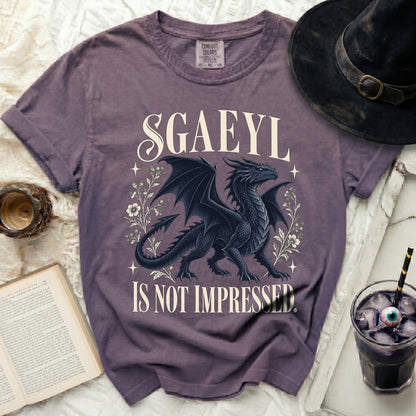 Purple t-shirt with a black dragon and text "SGAEYL IS NOT IMPRESSED."