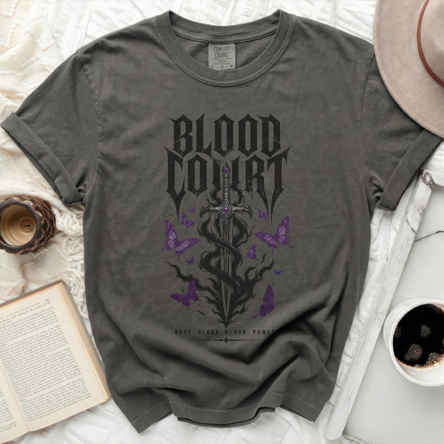 Dark grey t-shirt with "Blood Court" text, sword, and purple butterflies.