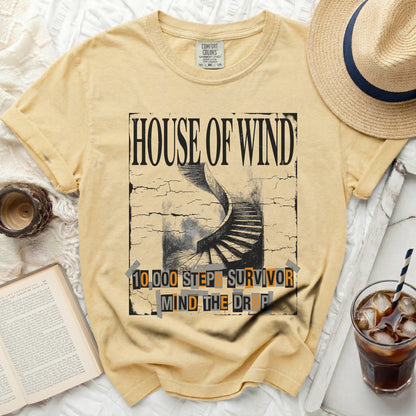 Yellow t-shirt with "House of Wind" and "10,000 Steps Survivor Mind The Drop" graphic.