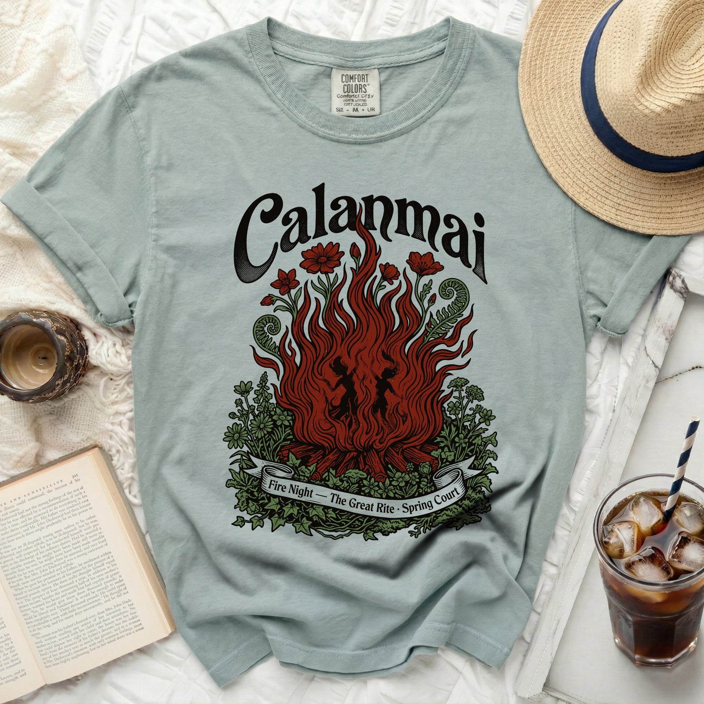 Light blue t-shirt with "Calanmai Fire Night - The Great Rite - Spring Court" graphic.