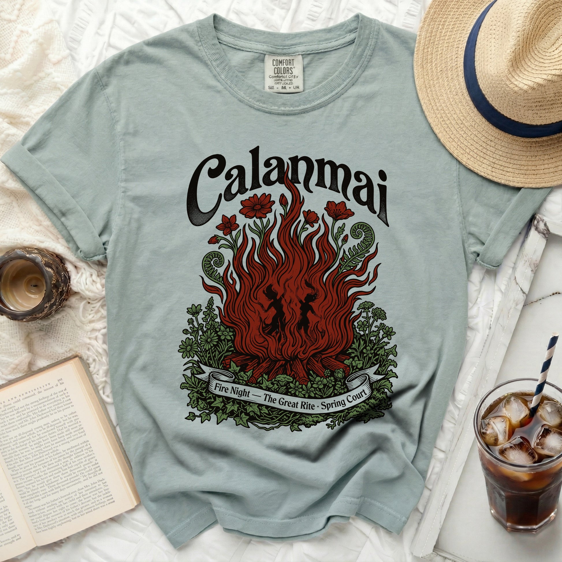 Light blue t-shirt with "Calanmai Fire Night - The Great Rite - Spring Court" graphic.