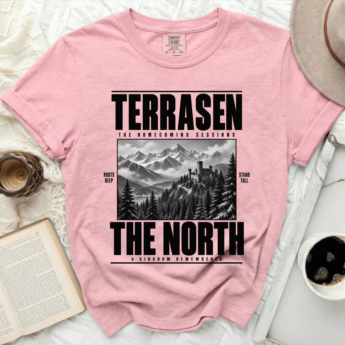 Pink t-shirt with "TERRASEN THE HOMECOMING SESSIONS THE NORTH" text and castle art.