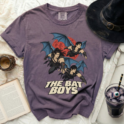 Purple t-shirt with "The Bat Boys" text and three winged figures against a red moon.