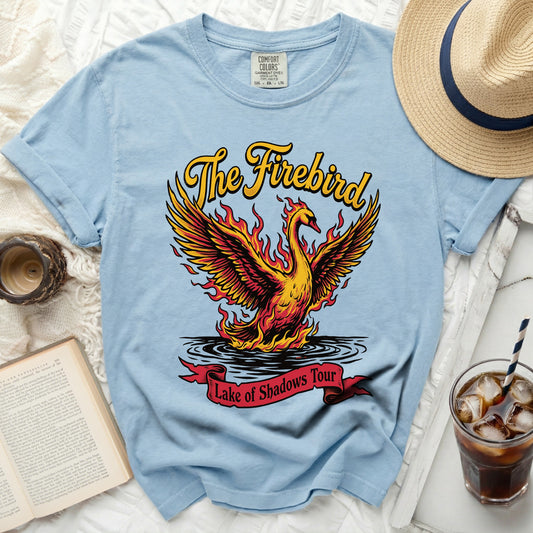 Light blue t-shirt with "The Firebird" text and a flaming phoenix graphic.