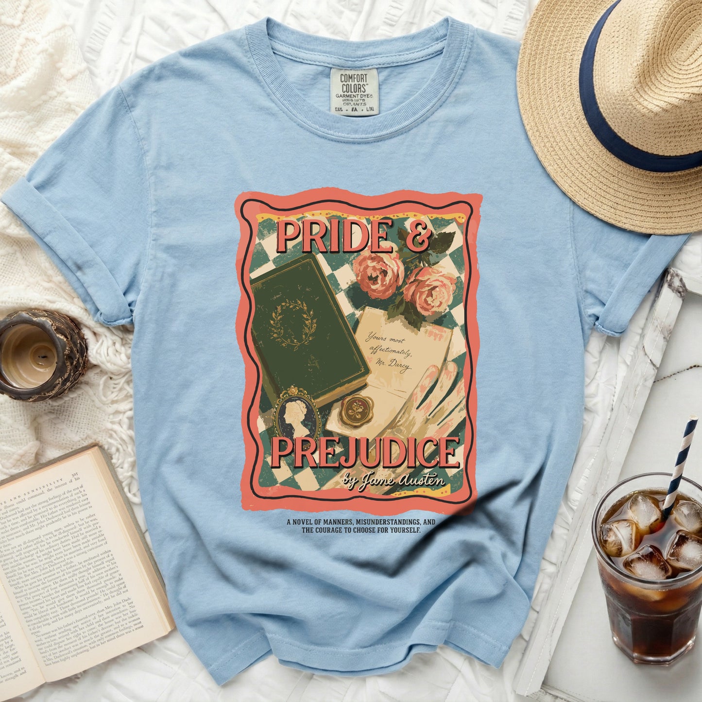 Light blue t-shirt with Pride & Prejudice book cover graphic by Jane Austen.