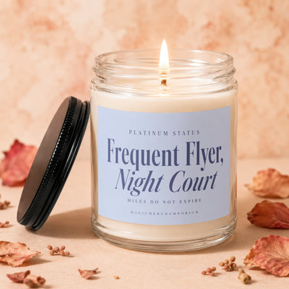 Candle with "Frequent Flyer, Night Court" and "Platinum Status" label.