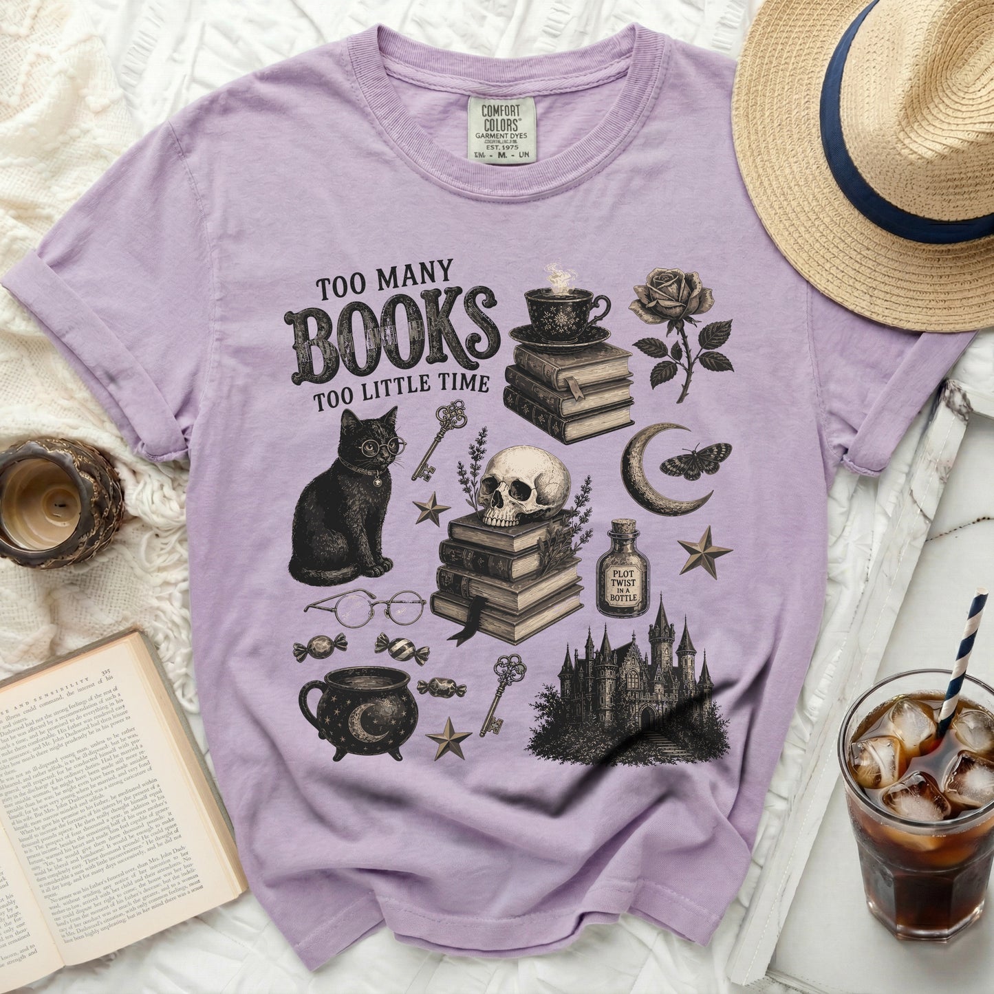 Lavender t-shirt with "Too Many Books Too Little Time" graphic art.