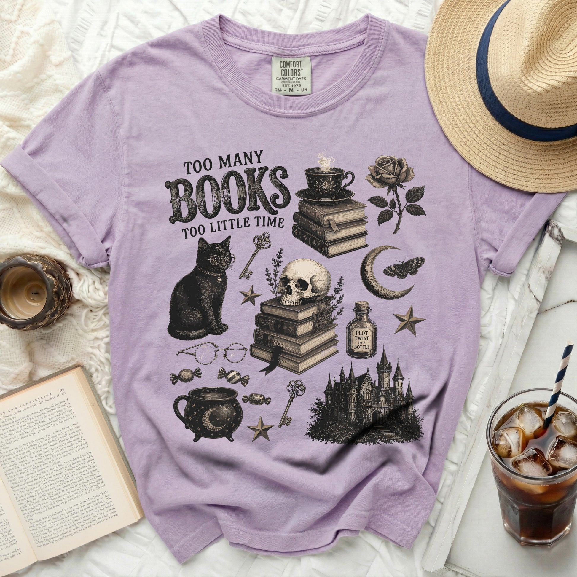 Lavender t-shirt with "Too Many Books Too Little Time" graphic art.