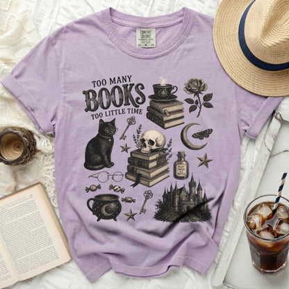 Lavender t-shirt with "Too Many Books Too Little Time" graphic art.