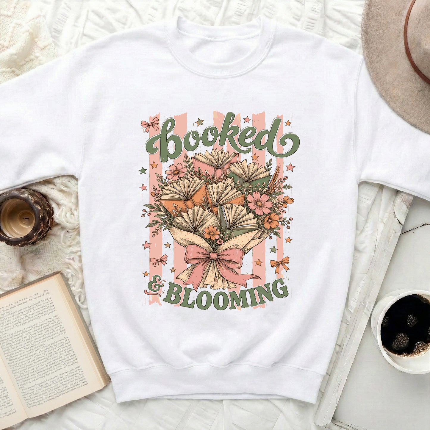 Graphic of books and flowers with text "booked & blooming"
