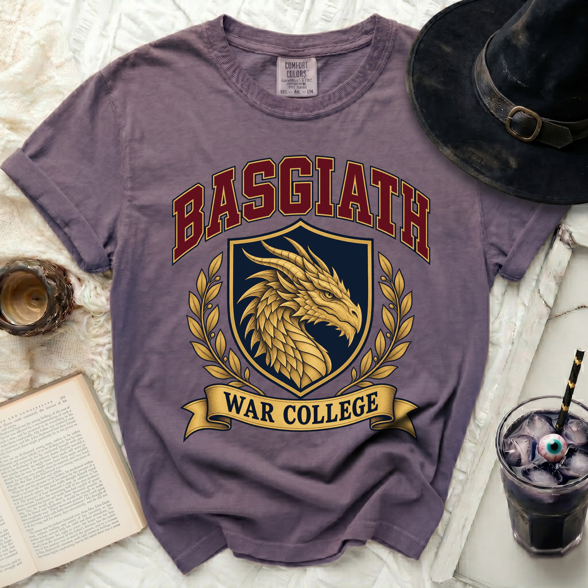 Purple t-shirt with a gold dragon emblem and text "Basgiath War College".