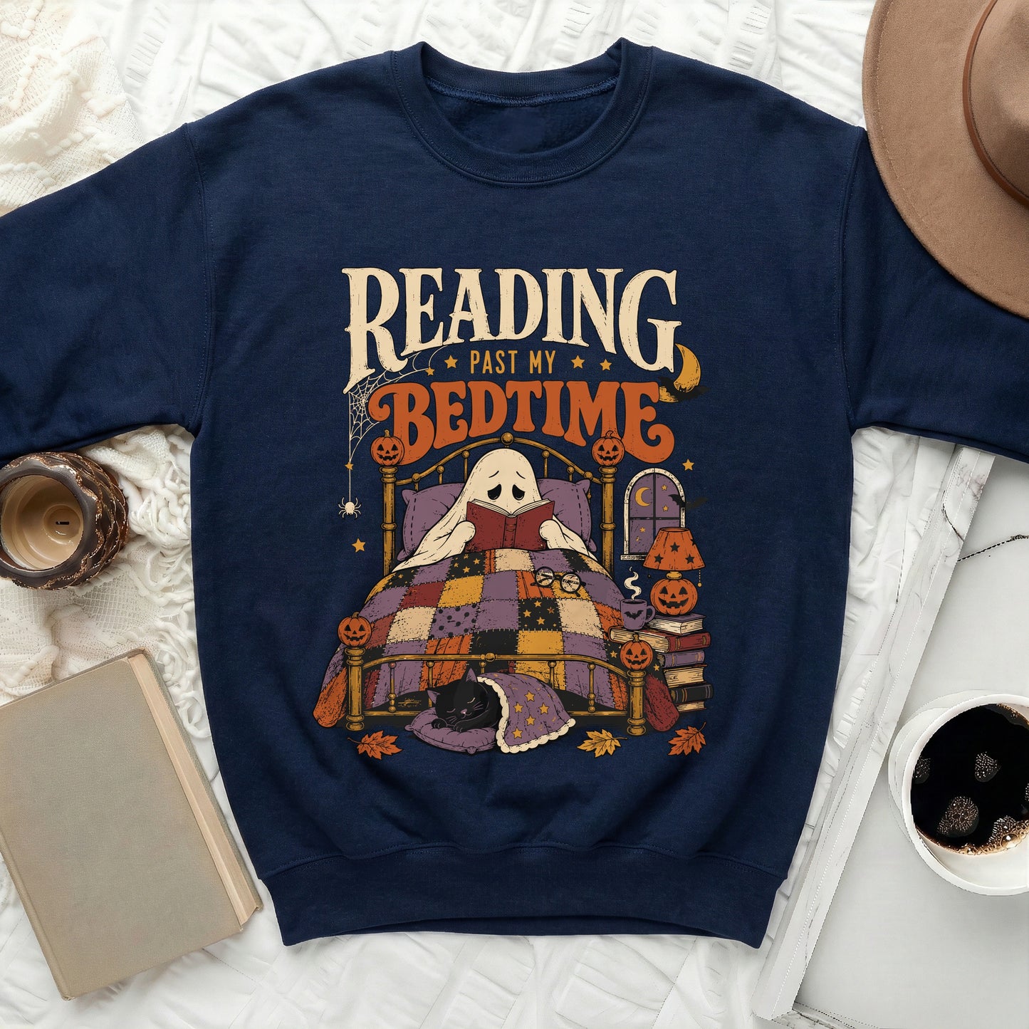 Navy sweatshirt with ghost reading in bed and "Reading Past My Bedtime" text.