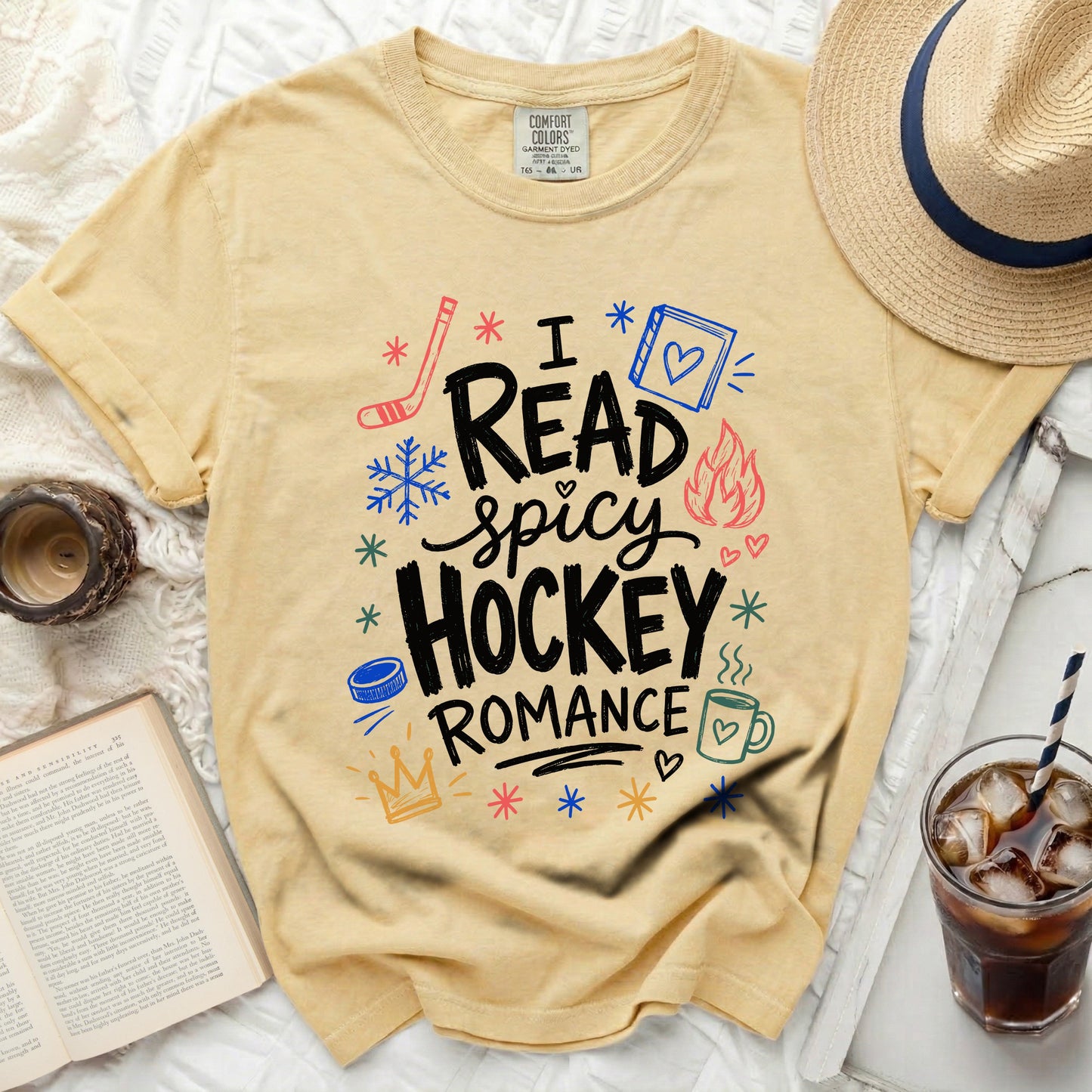 Yellow t-shirt with "I read spicy hockey romance" text and icons.