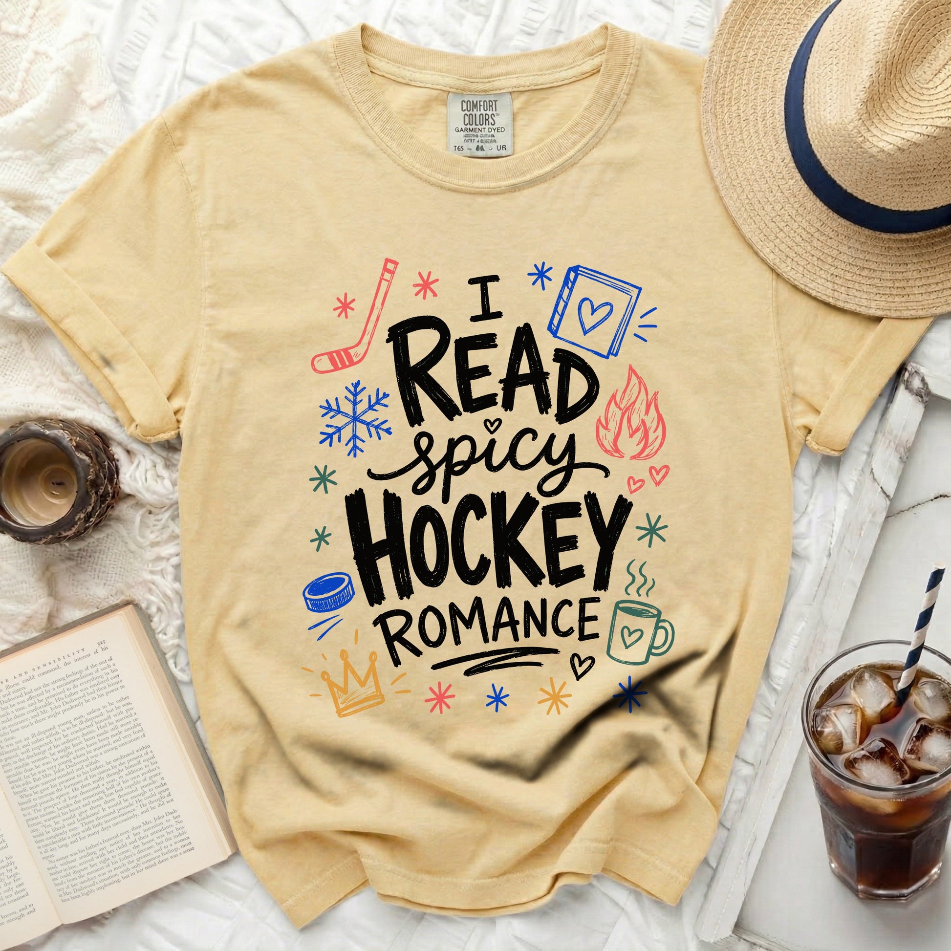 Yellow t-shirt with "I read spicy hockey romance" text and icons.