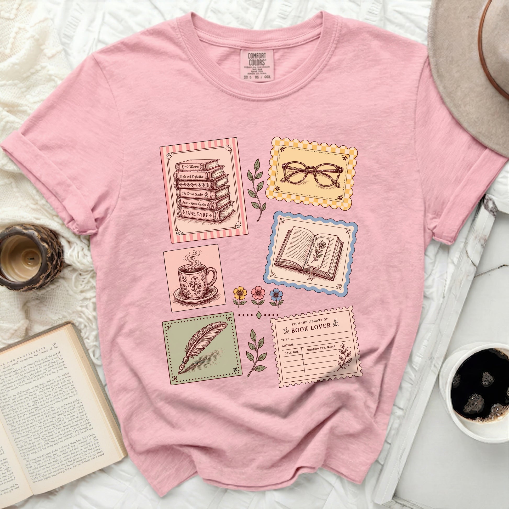 Pink t-shirt with vintage library and book illustrations and text.