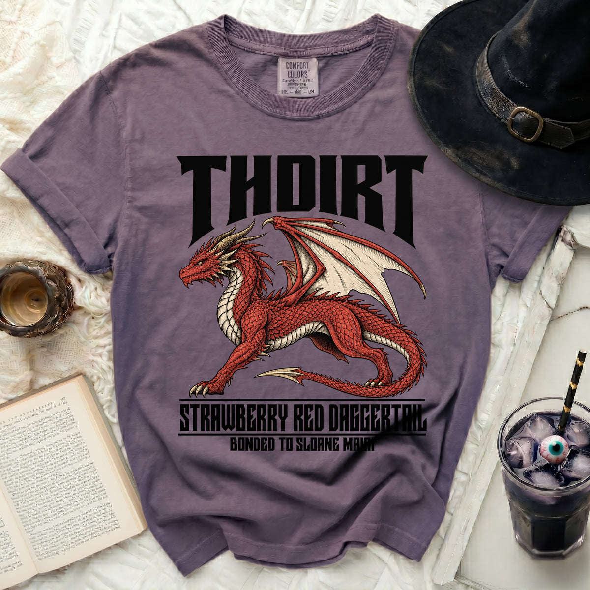 Purple t-shirt with a red dragon graphic and text: THOIRT, STRAWBERRY RED DAGGERTAIL.