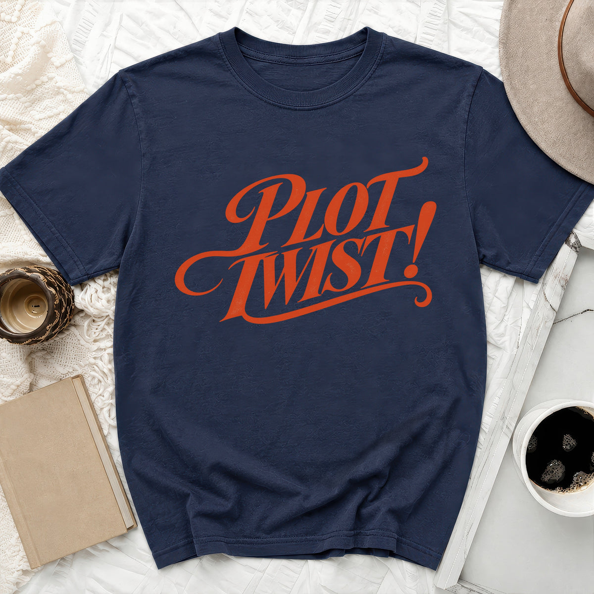 Navy t-shirt with orange "Plot Twist!" graphic.