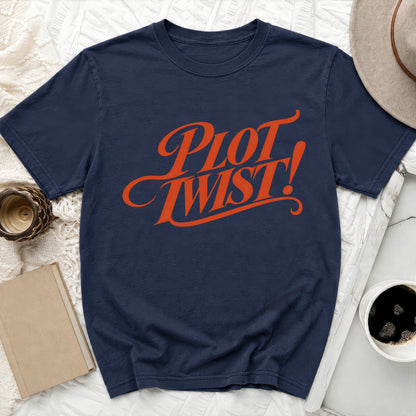 Navy t-shirt with orange "Plot Twist!" graphic.